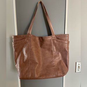 21x24x7 inches. Soft, buttery vegan leather. Beige with a hint of pink.